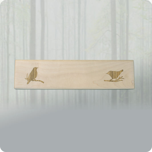 image shows the Wren Serving Tray by 14 Acre Designs. It is made of solid maple wood and features a bird shaped inlay made of zebra wood by local Mendocino craftsman. Perfect for serving finger foods at parties, weddings and other social gatherings.