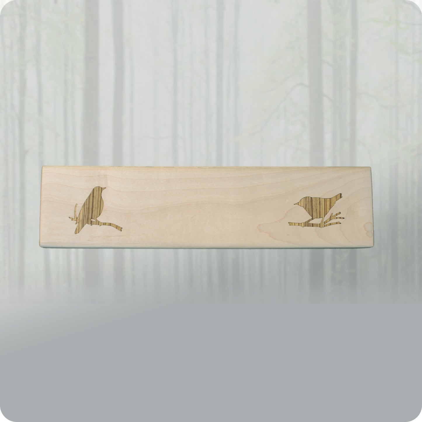 image shows the Wren Serving Tray by 14 Acre Designs.  It is made of solid maple wood and features a bird shaped inlay made of zebra wood by local Mendocino craftsman. Perfect for serving finger foods at parties, weddings and other social gatherings.